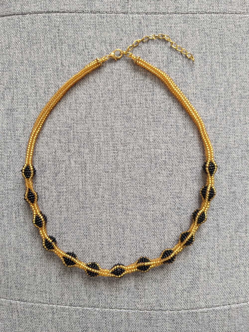 Gold and Black Beaded Women's Necklace - Elegant Twist Design